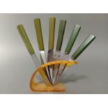 A set of Art Deco style green bakelite handle knives, the curved steel blades marked 'Rostfrei',