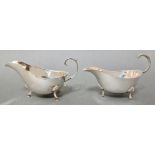 A pair of silver gravy boats, one hallmarked for 1912, Birmingham, J Sherwood & Sons, the other
