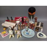 A box of collectables including Art Deco style porcelain dog figures, Dinky and Corgi glass signs,