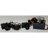 A vintage Zenit EM camera, a Zenit TTL camera, a Olympus OM30 camera and a Voigtlander Vito B