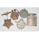 A mixed lot comprising an Egypt War 1884-6 medal, a trench art lighter, a tank regiment badge, a