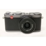 A Leica X1 digital camera, steel grey, with Elmarit 1:2.8/24 ASPH lens, serial no. 3815631,