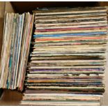 A box of LPs including W.A.S.P. , The Doobies, The Mission, etc