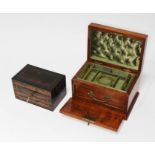 An antique walnut jewellery box with fitted interior, brass handle and key and an inlaid