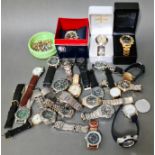 A box of assorted wristwatches and costume jewellery.