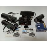 A Chinon camera with two extra lenses and flash.