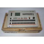 A Roland Rhythm Composer TR-707 drum machine, made in Japan, serial number 536600, with manual and