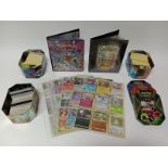 A box of Pokemon cards, approximately 1000 including 99 holo cards.