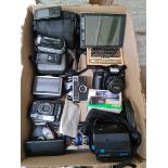 A box of miscellaneous cameras, telephones and navigators to include Minolta Dynax 300si, Polaroid