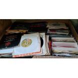 A box of 45s, various genre including Mike & The Mechanics, The Tremoleos, rock, pop, etc.