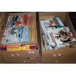 Two boxes of approx. 300 Commando comics.