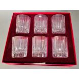 A set of 6 Baccarat crystal drinking glasses in original case.