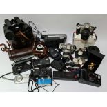 A box of various cameras and related items including two Canon EOS 300 cameras, Canon Ixus digital
