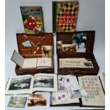 Two vintage cases containing various militaria, pictures, stamps and vintage autograph booklets