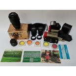 A collection of camera accessories to include Nikon AF Nikkor 70-300mm lens, a Canon FD 60mm lens, 2