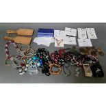 A box of assorted costume jewellery.