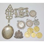 A mixed lot including a Continetal spoon marked '800' and also with pseudo marks, gilt metal