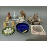 A box of mixed ceramics including Moorcroft dishes, Poole plates, Wade figures, Nao, Goebel etc.