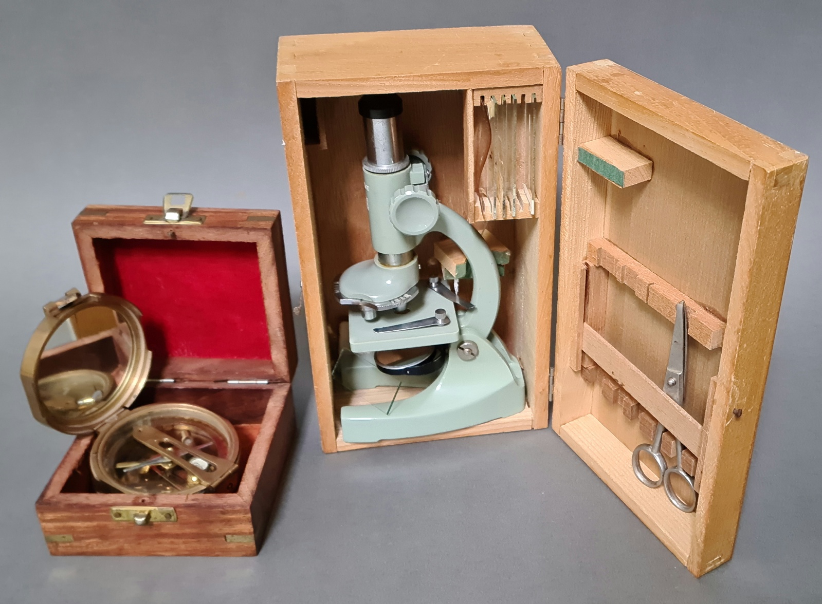 A vintage boxed Regent student microscope with few accessories and a reproduction Natural Sine brass