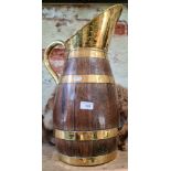 A brass bound barrel jug.