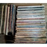 A box of LPs including Mammoth Fatman, Magnetic Heaven, Cher, rock, pop, etc.