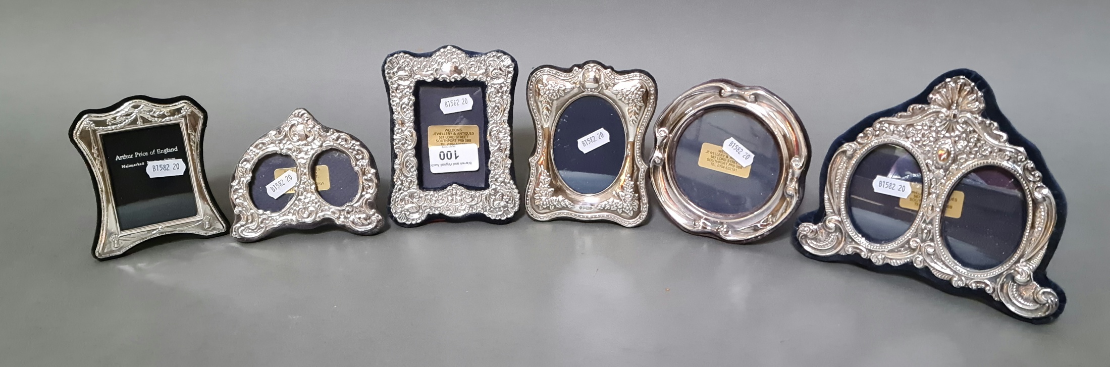 Six silver photograph frames.