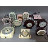 Ten Art Deco clocks, various makes and colours to include Smiths, Metamec, Ferranti, brown, cream