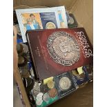 A box of world coins, commemorative crowns and a Coins of England book