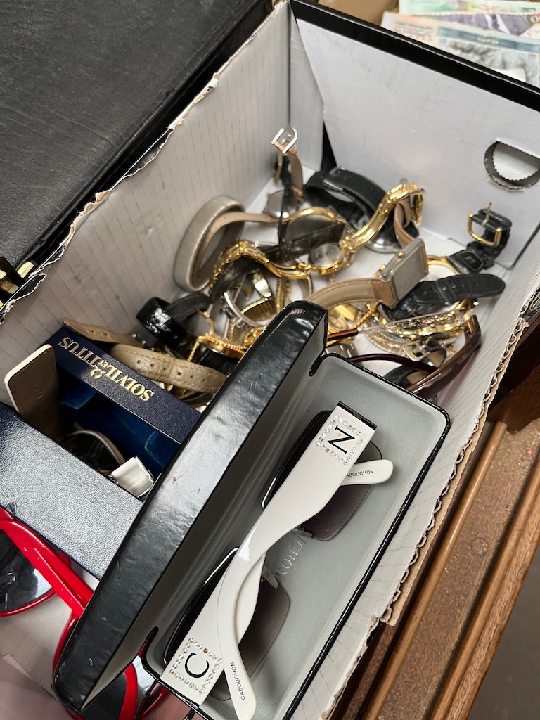 A box of wristwatches and sun glasses including Cabouchon