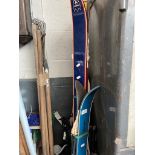 A pair of skis and a pair of cross country skis with poles