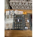 2 trays of commemorative coins to include, crowns, pennies, some foreign banknotes, etc.