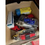 A small box of die-cast vehicles