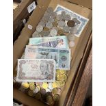 A box of world coins and banknotes