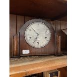 A circa 1950s Smiths Enfield domed mantel clock with pendulum and key.