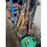 A large quantity of garden tools including rakes, brushes, spades, forks, hozelock portable garden