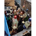 A box containing 22 bottles of various alcoholic beverages including Brandy, Gin,Whisky,Sherry,
