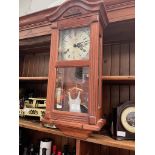 A Lincoln 31 day wall clock and an inlaid mahogany mantle clock, both with pendulum and key.