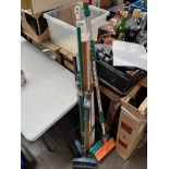 A bundle of hose brush attachments, roller blind, metal clothes prop, wooden metre rule