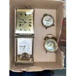 Two brass and glass carriage clocks to include a German Schatz and 2 small alarm clocks.