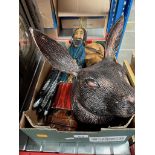 A box of various items to include a cast metal rabbit head, an Orthoceras and 2 carved wooden