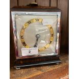 An Art Deco style 3 day mantel clock with key.