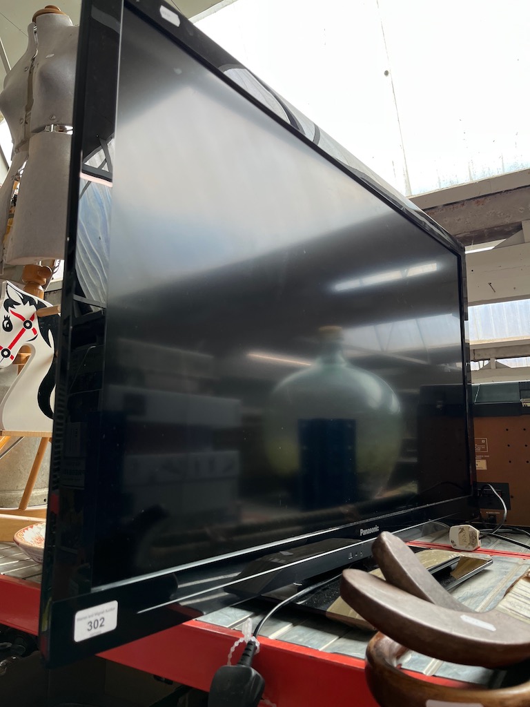 A 42" Panasonic Viera TV with remote, model number TX-L42E3B