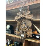 A Black Forest - August Schwer cuckoo clock, made in West Germany, with pendulum and weights.