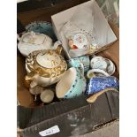 A box containing Sadler teapots and other ceramics
