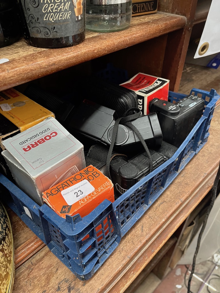 A box of cameras and accessories.