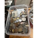 A tin and a tub of world coins