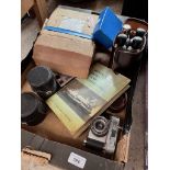 A box of cameras, accessories, lenses, etc.