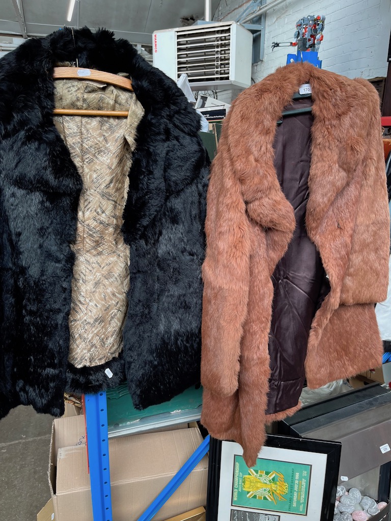 A Coney fur jacket and another.