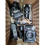 A box of cameras & accessories to include Halina 3000, Zenit-E & a Pentagon lense etc.