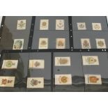 A collection of 18 vintage regimental silk badges.